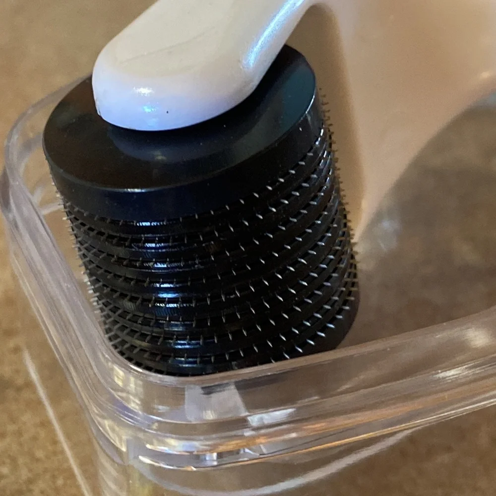 Brookstone Micro Needling Facial Massage Roller in White and Black